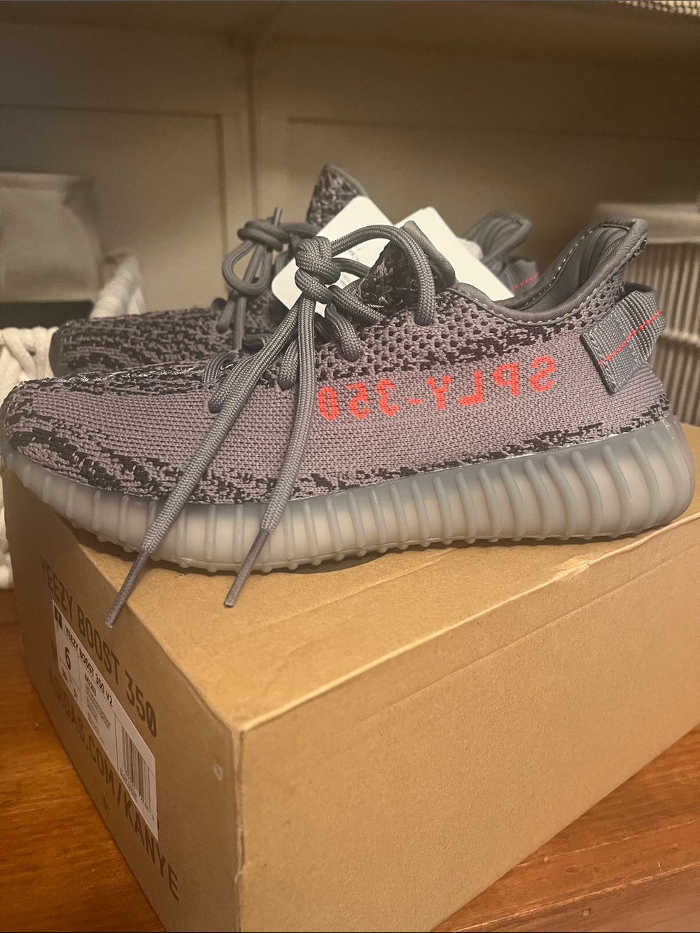 Yeezy Grey Sneakers with Orange Stripe